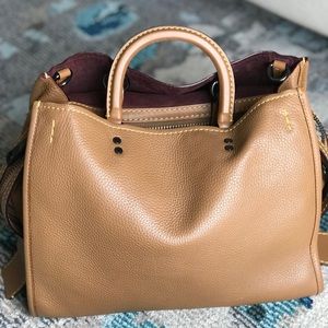 Preowned Coach Rogue 30 in light saddle